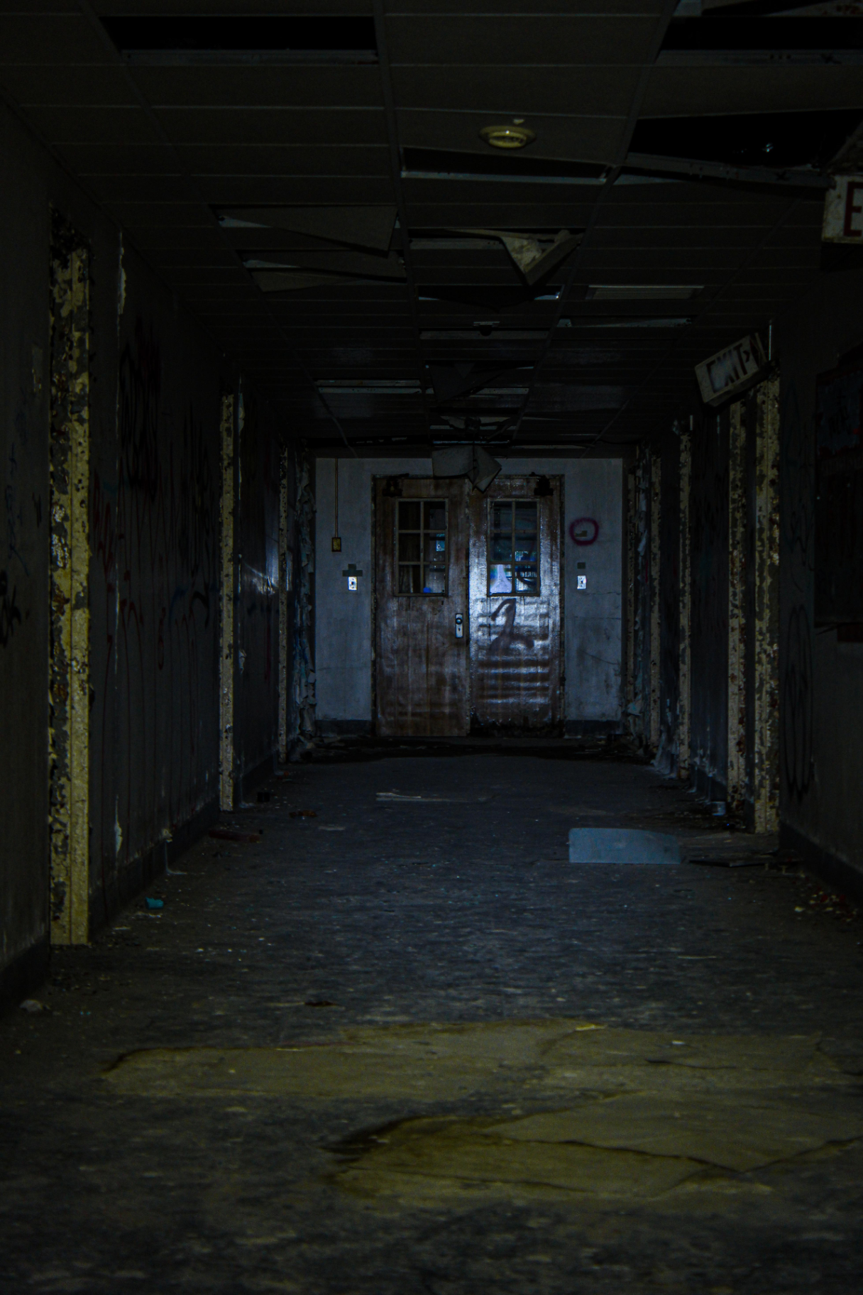 A dark hallway where footsteps are said to echo.